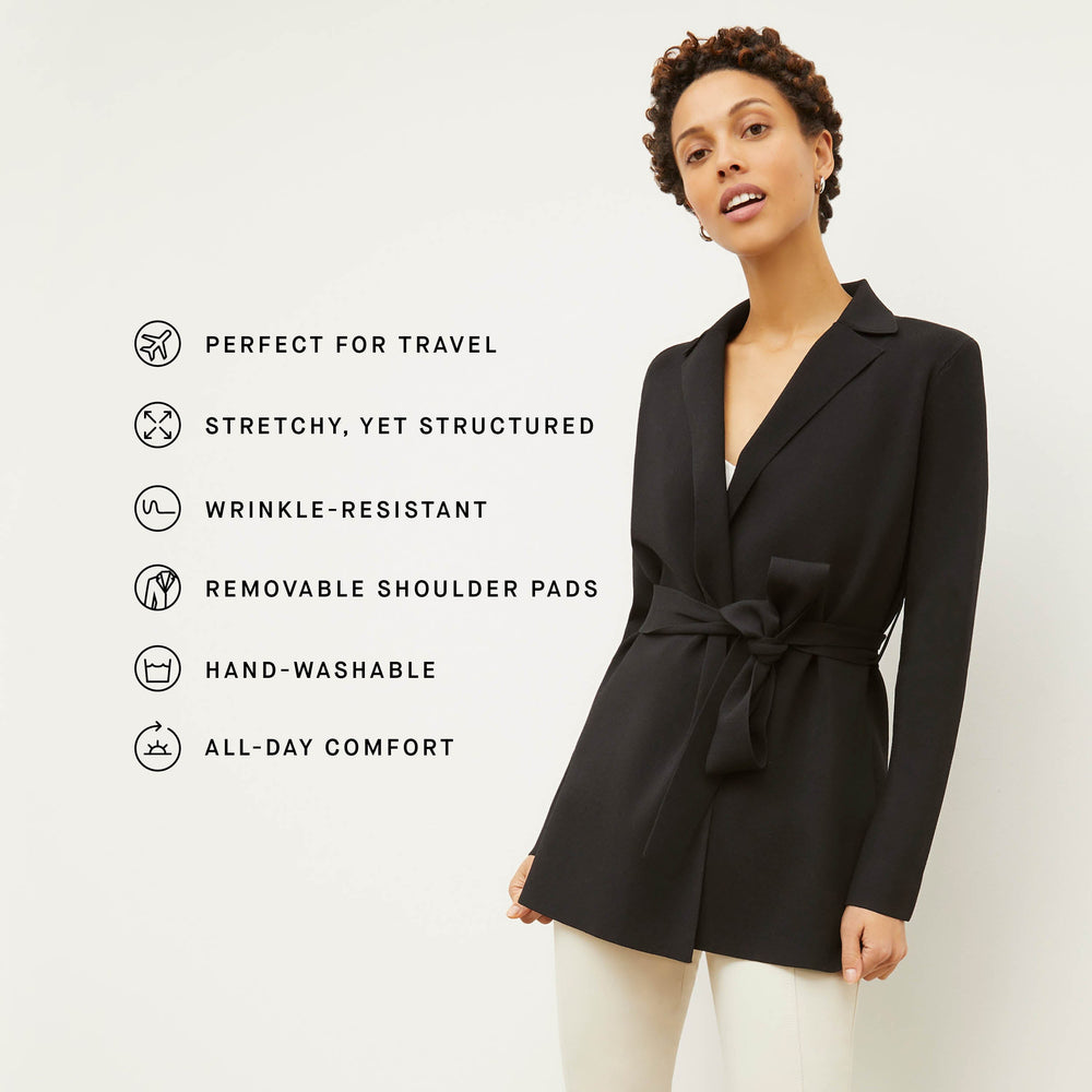 Image of a woman wearing the Merritt Jardigan in Black with icons of the product's features to the left