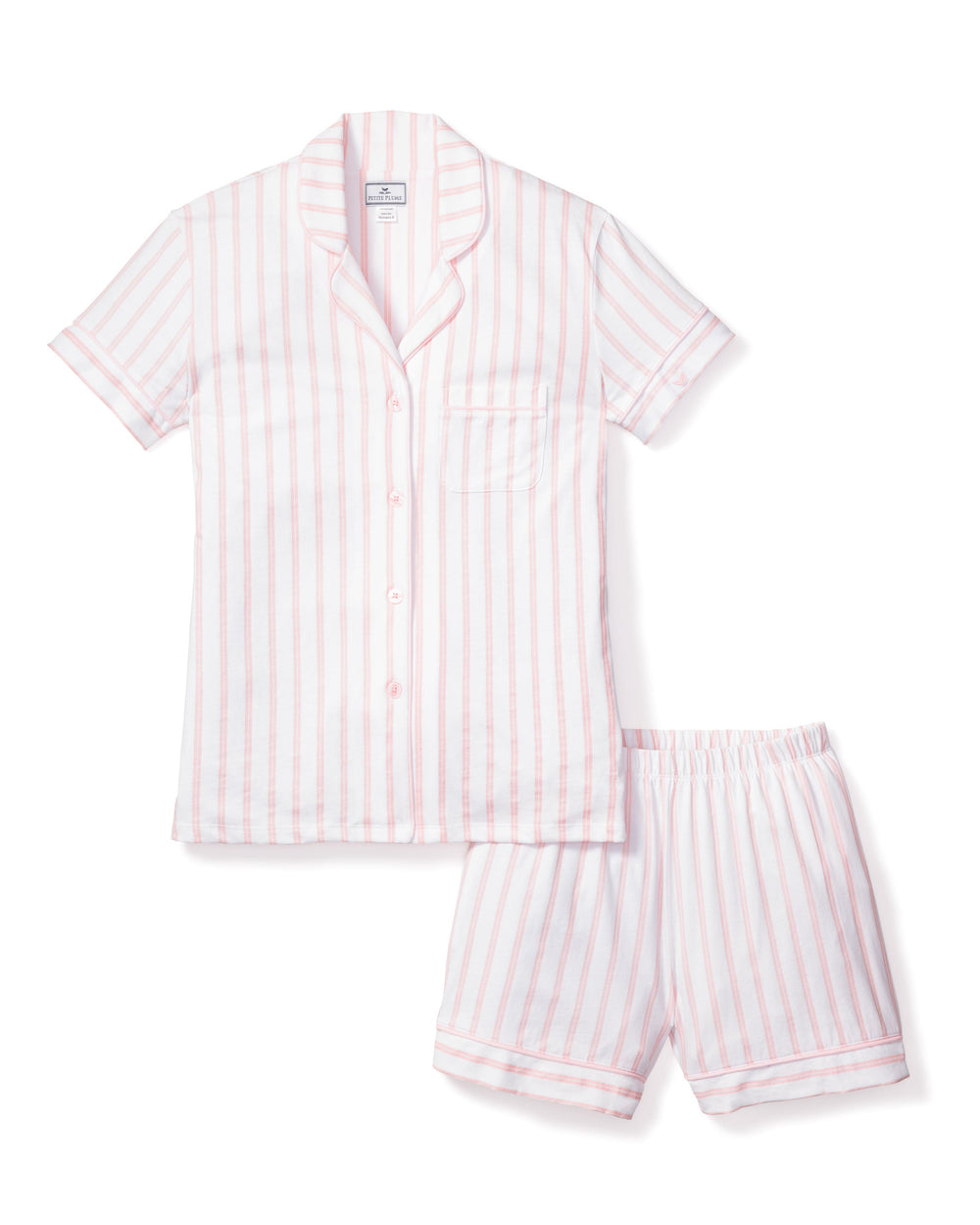 Pink and white striped pajama set on a white background