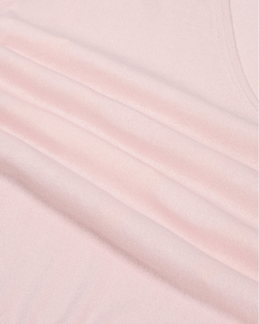 Close-up of pink fabric with subtle texture