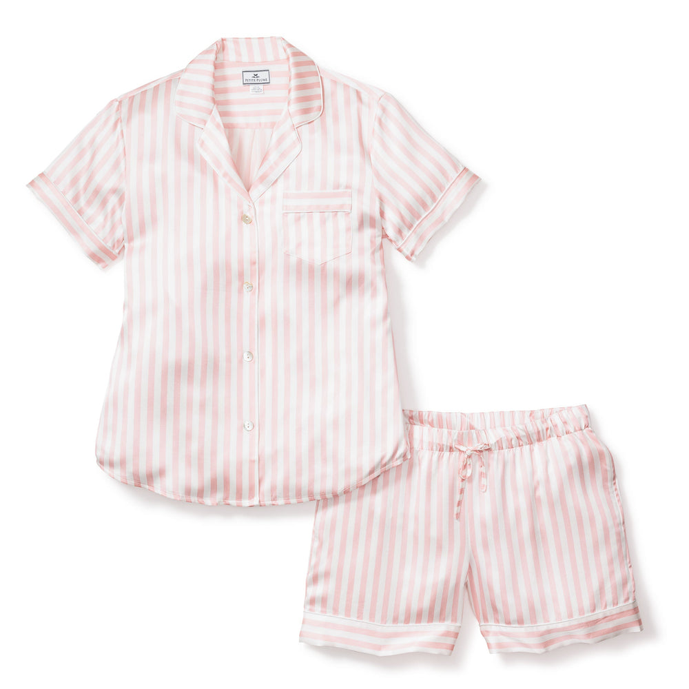 Pink and white striped pajama set on a white background