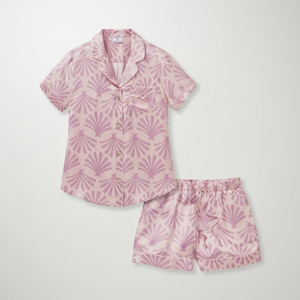 Pink pajama set with leaf pattern on a white background