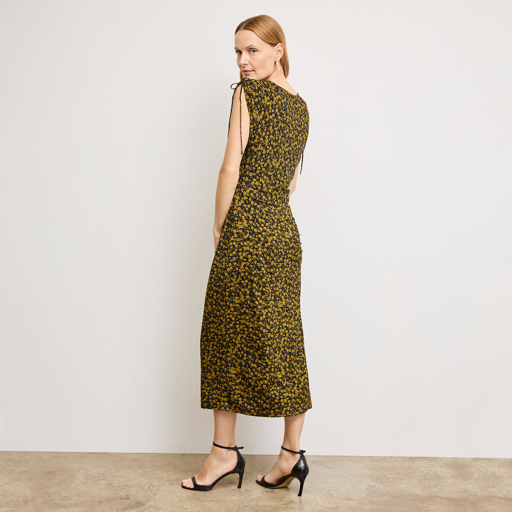 back image of a woman wearing the aisling dress in bloom print