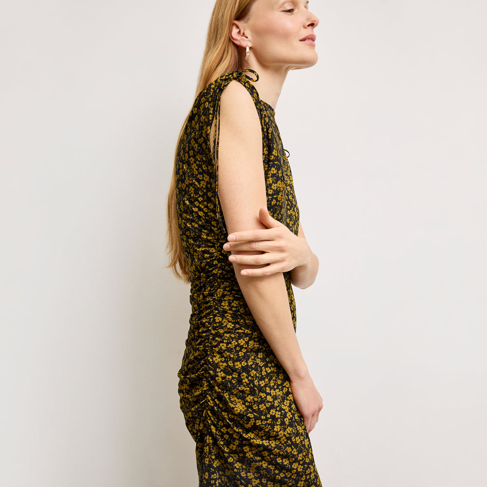 side image of a woman wearing the aisling dress in bloom print