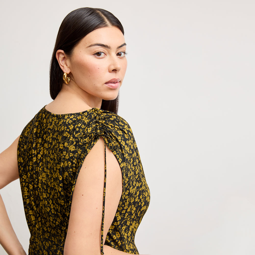 back image of a woman wearing the aisling dress in bloom print