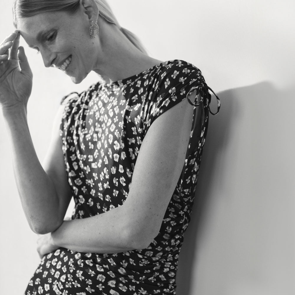 front image of a woman wearing the aisling dress in kaleidoscope