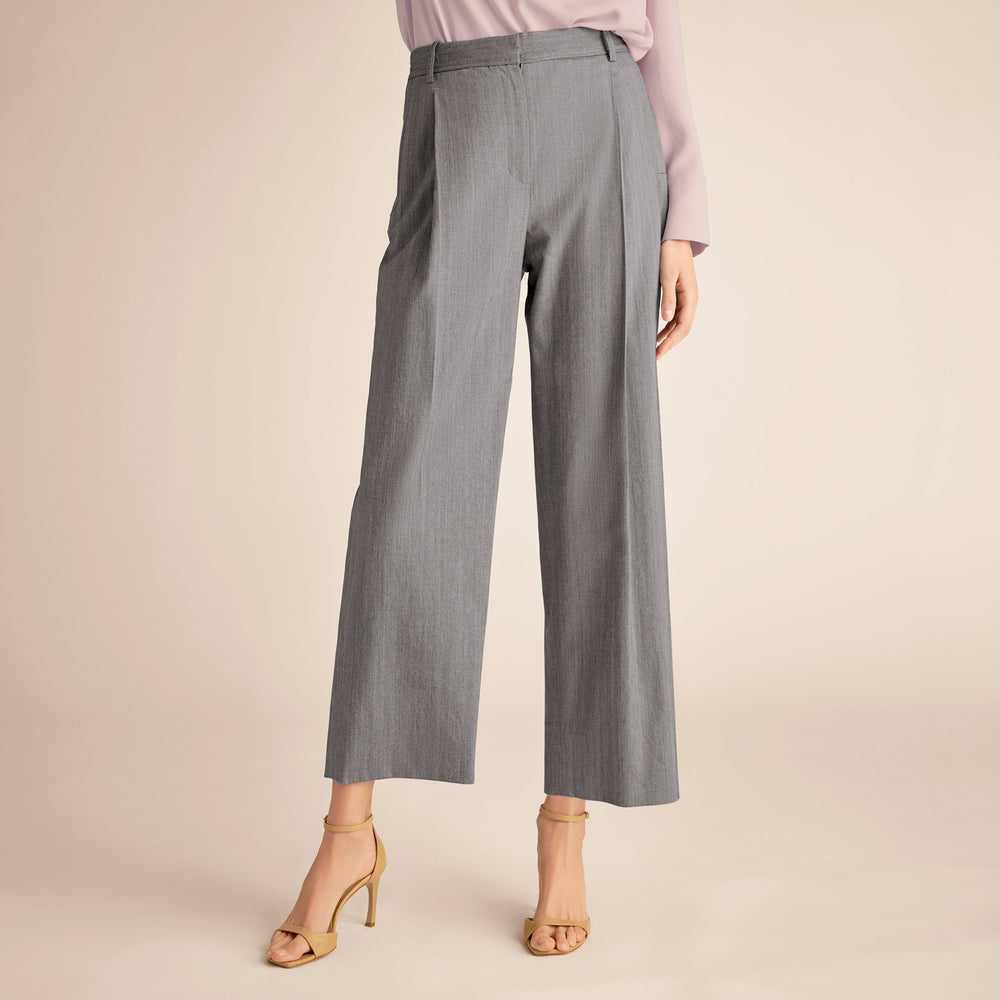 Gray wide-leg pants worn by a person on a beige background