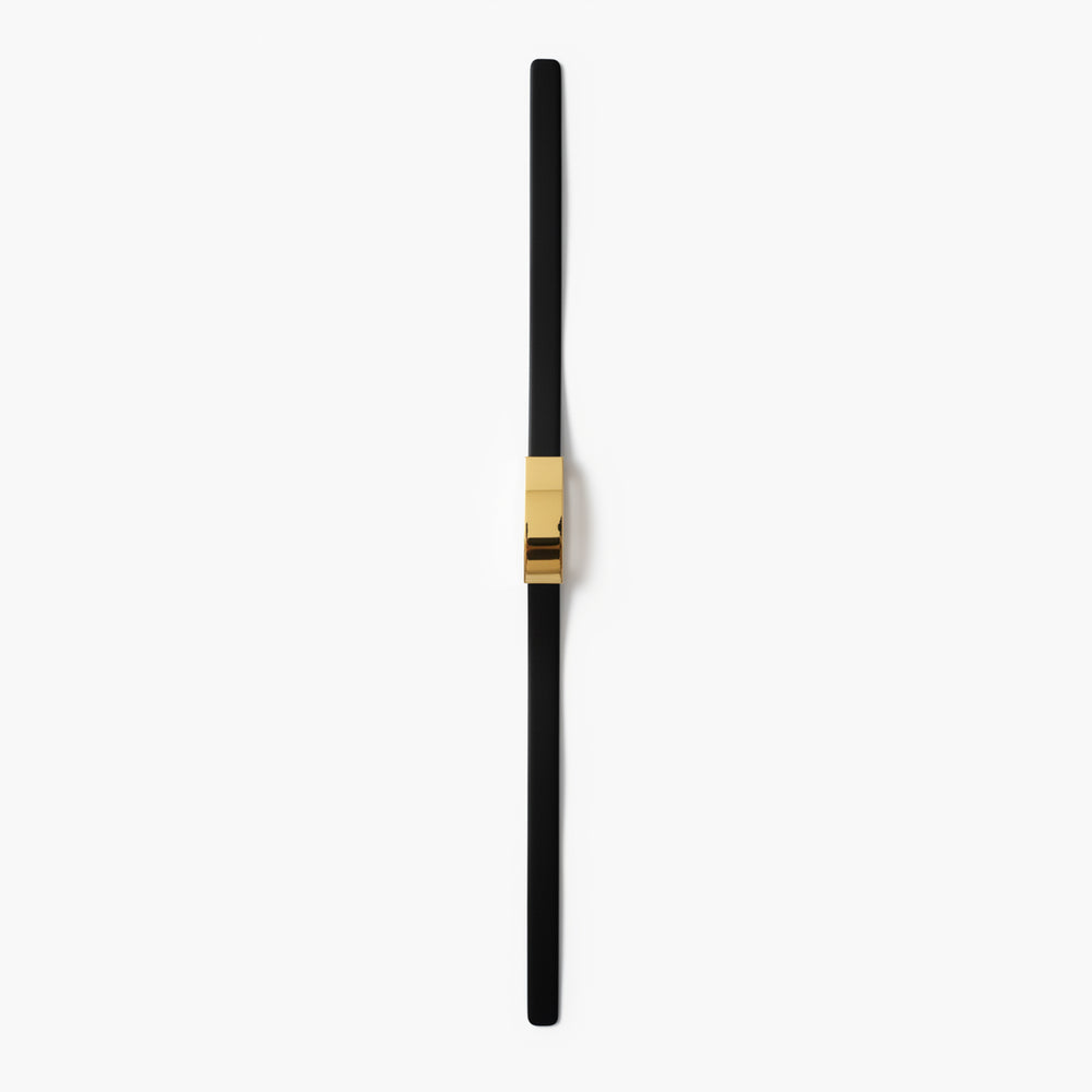 Black and gold pen on a white background