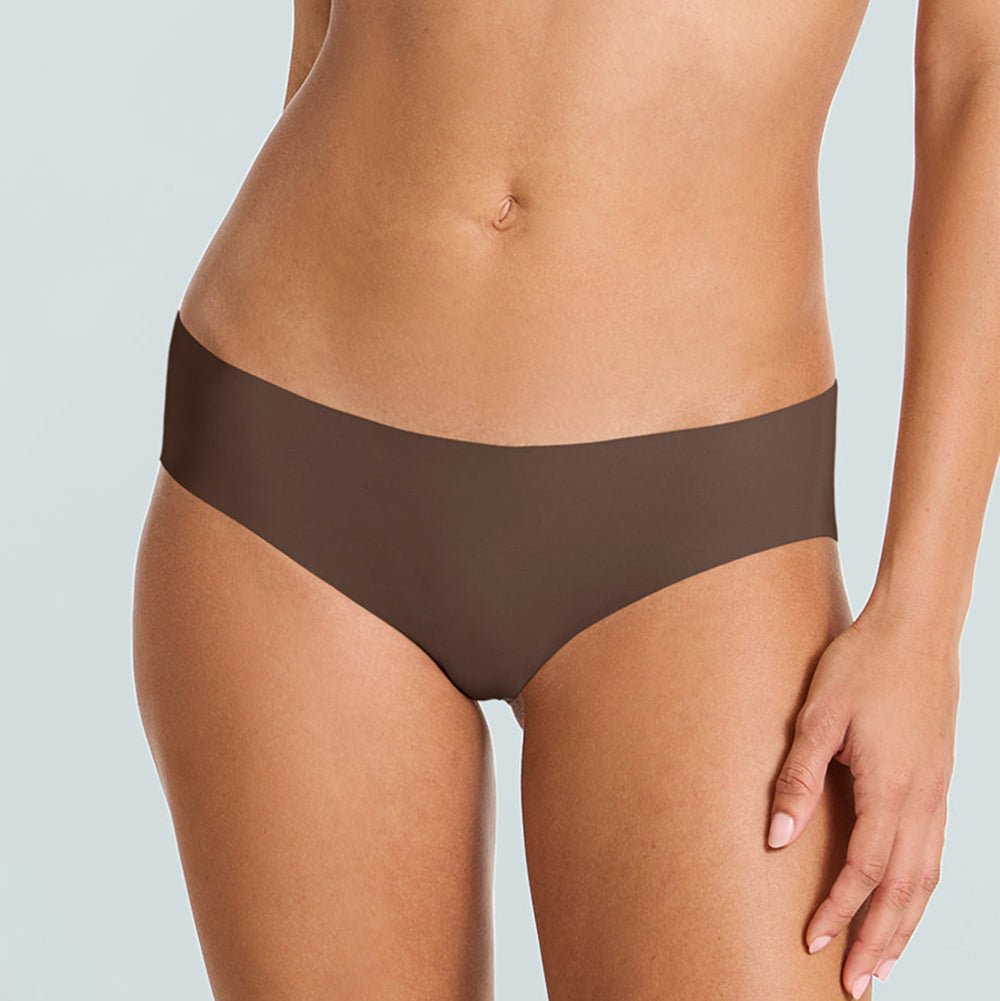Brown underwear worn by a person on a light gray background