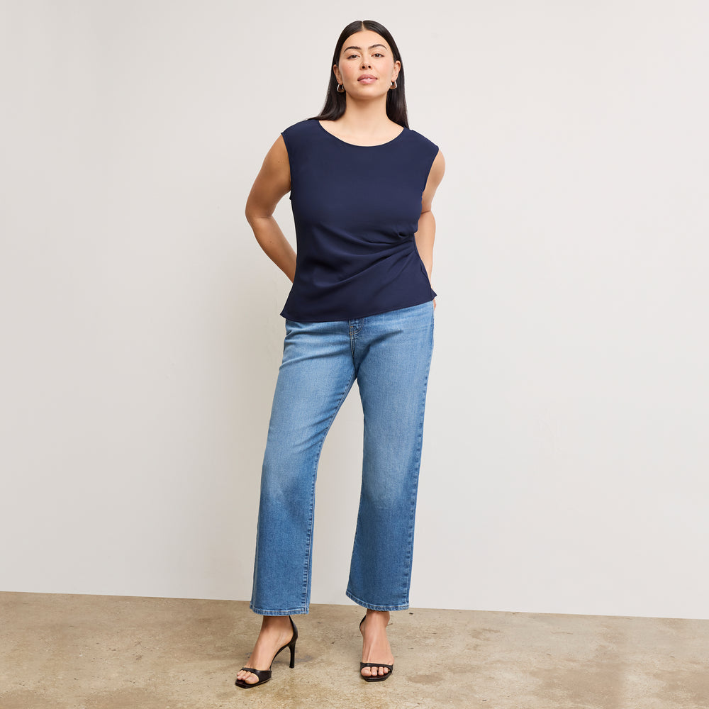 front image of a woman wearing the brooke top in soft navy