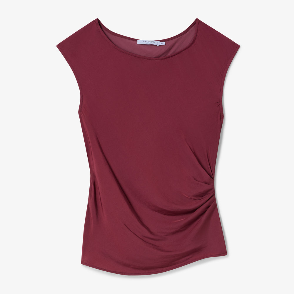 Maroon sleeveless top on a light gray background