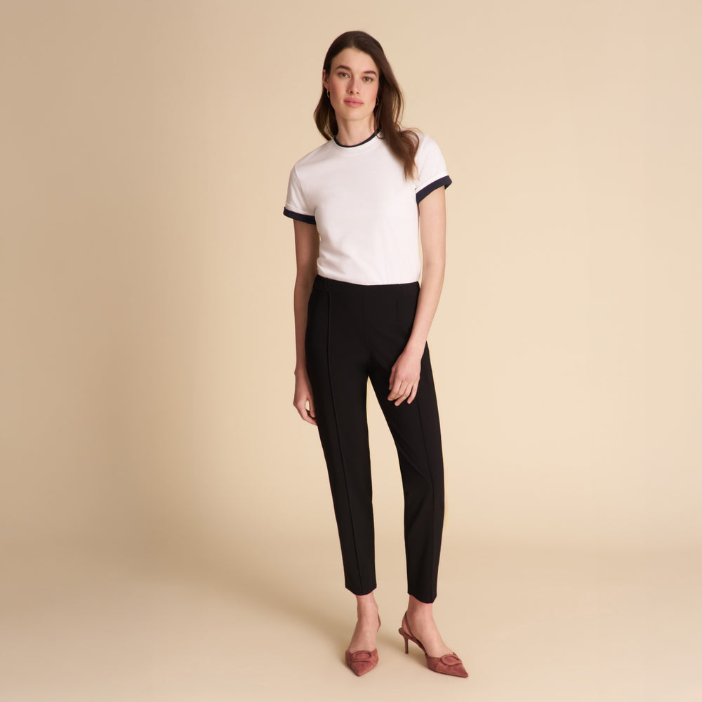 Women wearing the Leslie shirt in white on a beige background