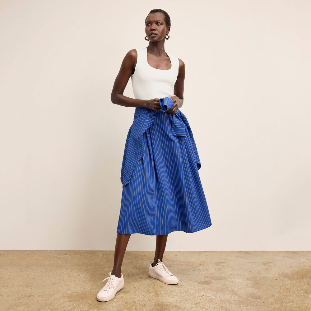 front image of a woman wearing the easton skirt in soft stripe