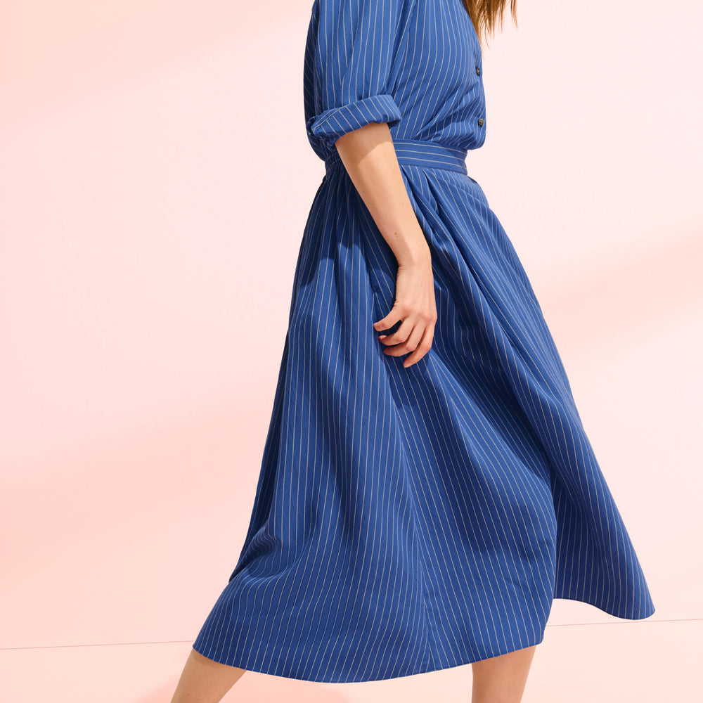 front image of a woman wearing the gia top and easton skirt in soft stripe