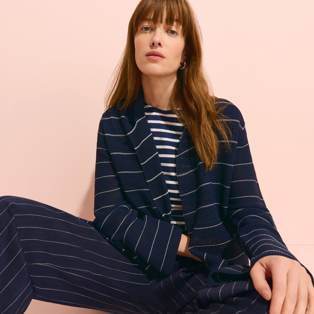 front image of a woman wearing the cody jardigan in dot knit and saint james tee