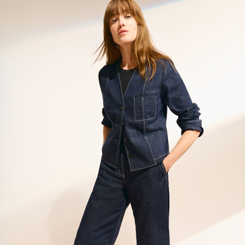 front image of a woman wearing the ayla jacket in midnight wash
