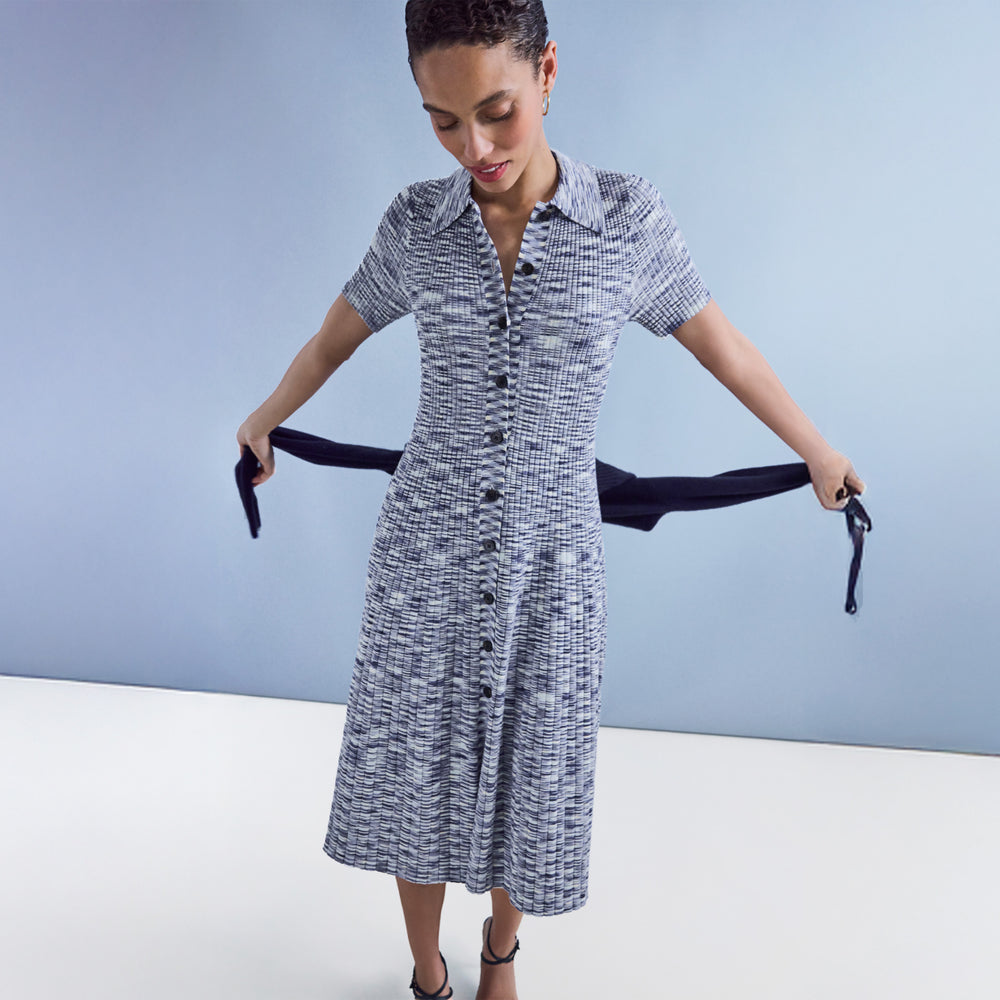 Woman wearing a blue patterned dress
