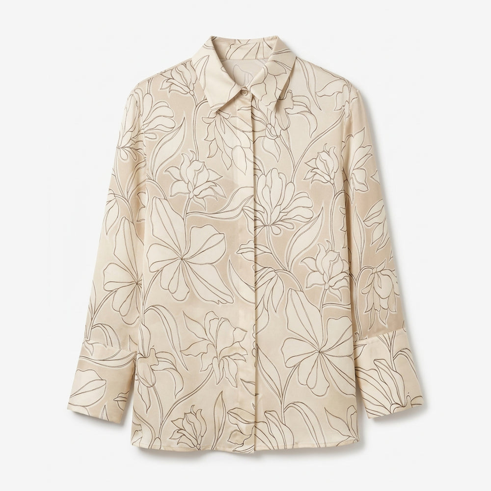 Beige floral patterned shirt on a white background