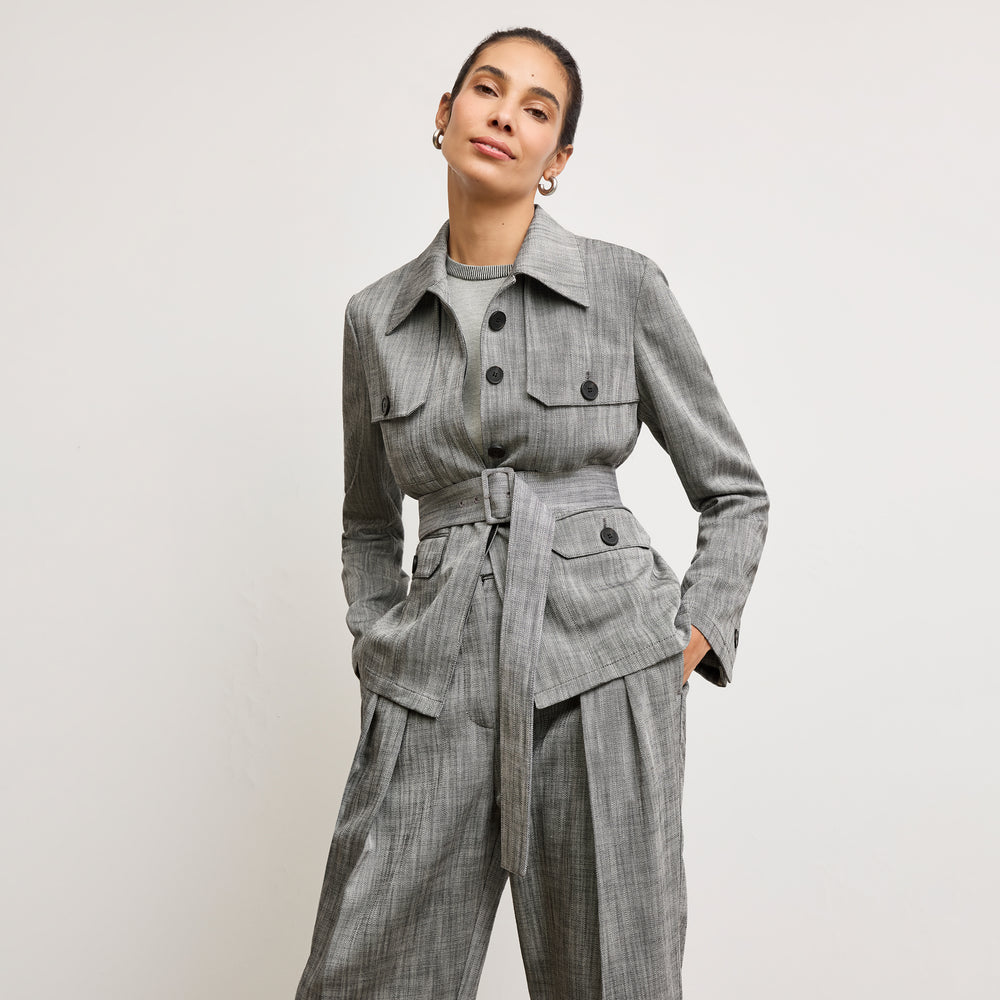 Front image of a woman wearing the emery jacket in Black/White Porto Weave