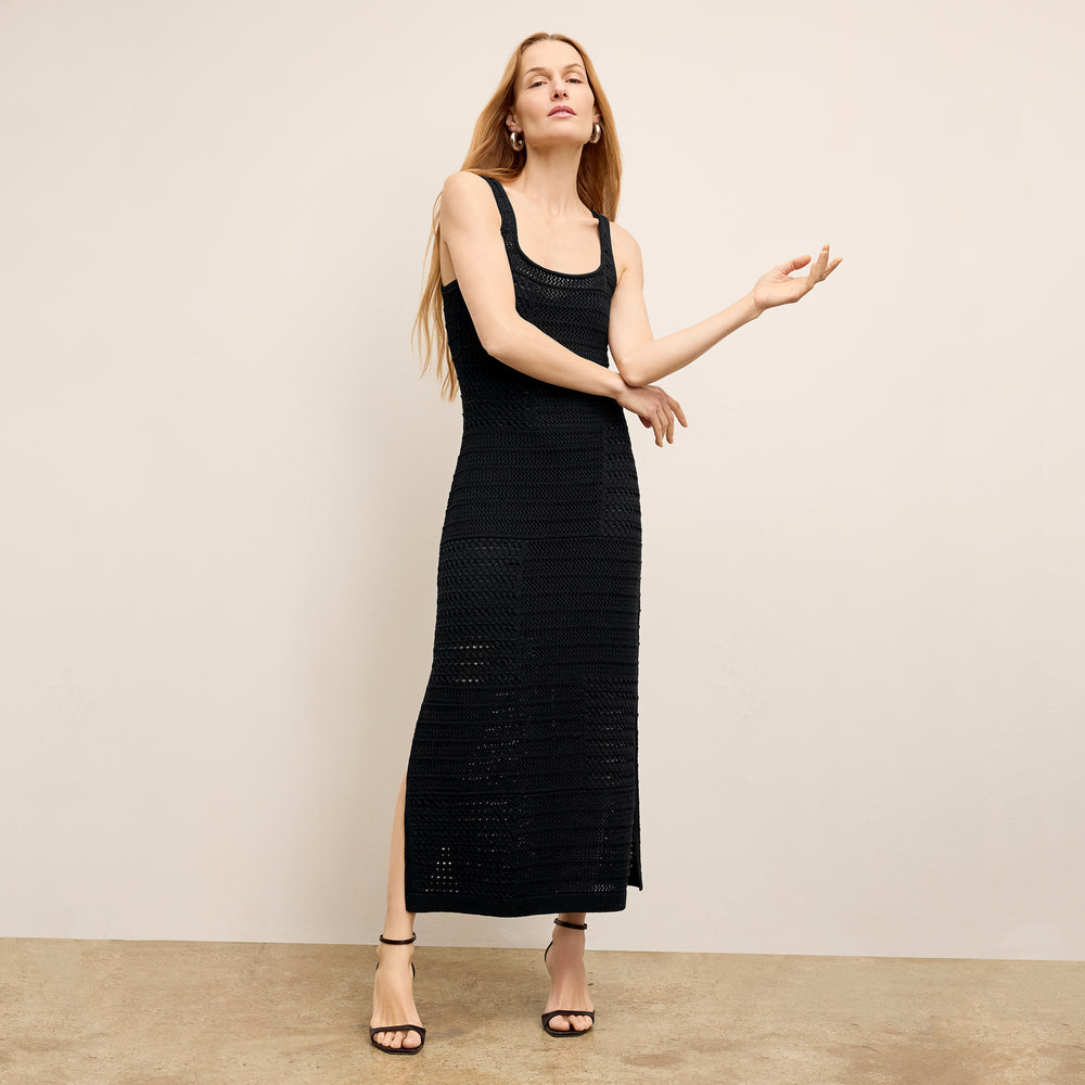 Front image of a woman wearing the Fina Dress in black