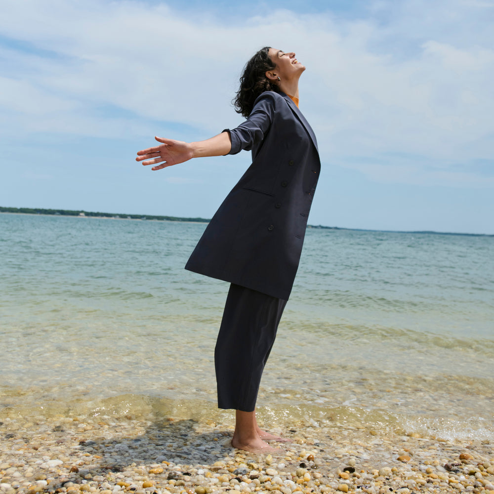 side image of a woman wearing the elena pant in cool charcoal