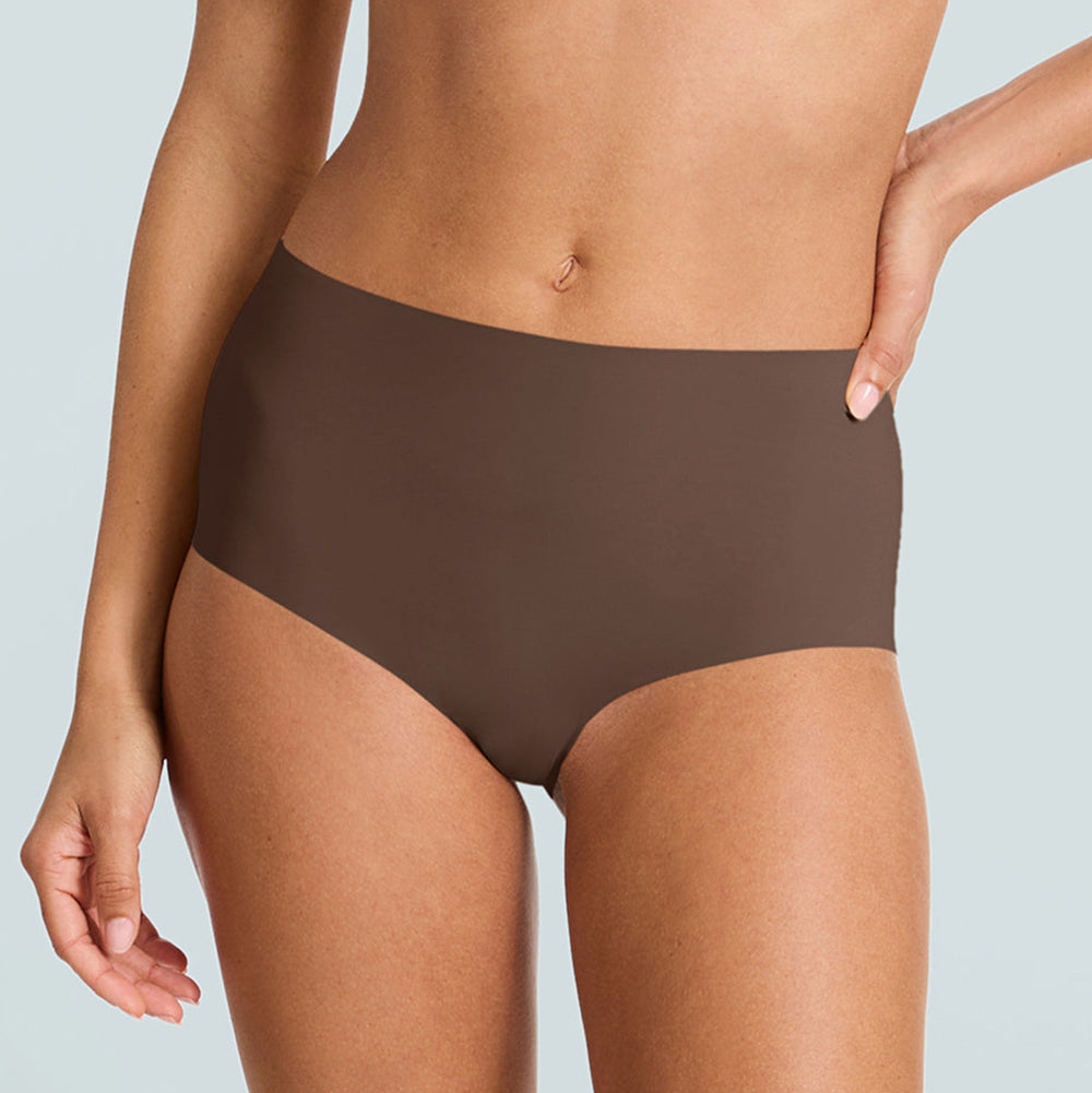 Brown high-waisted underwear worn by a person on a light gray background