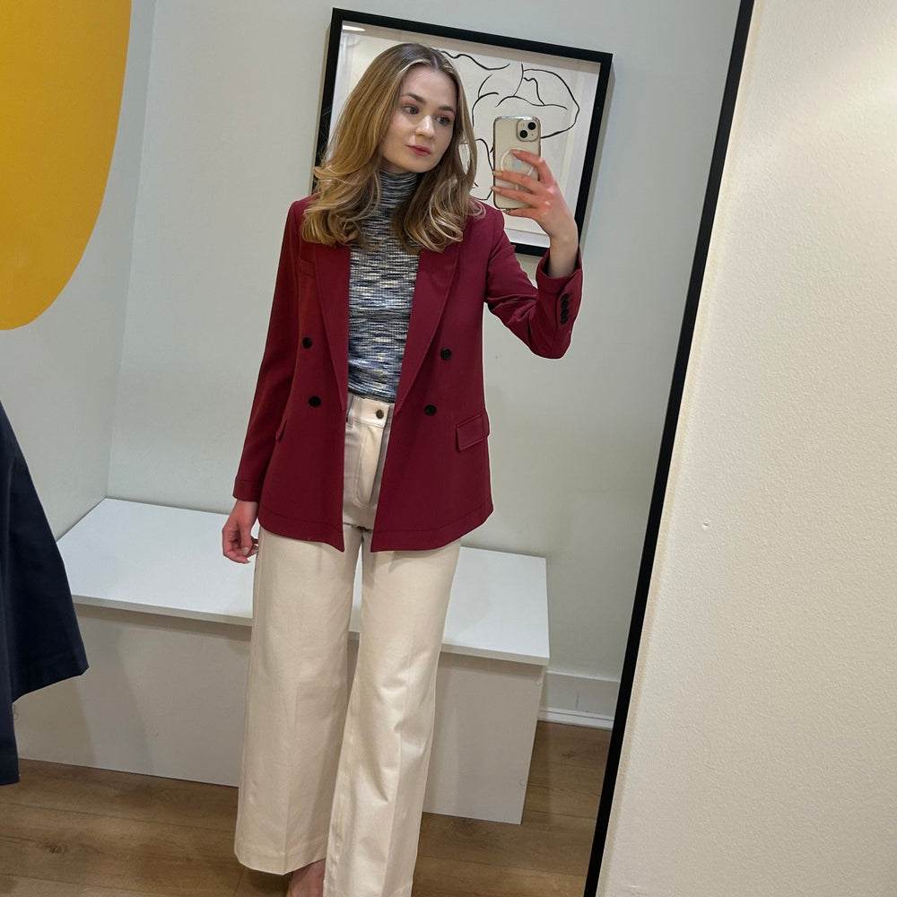 image of a woman wearing the koa turtleneck