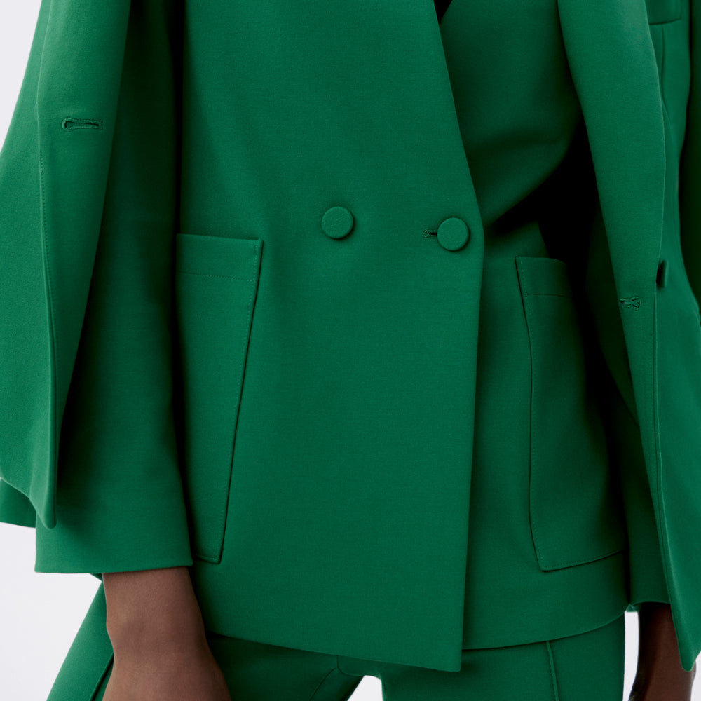 detail image of a woman wearing the janette jacket in shamrock