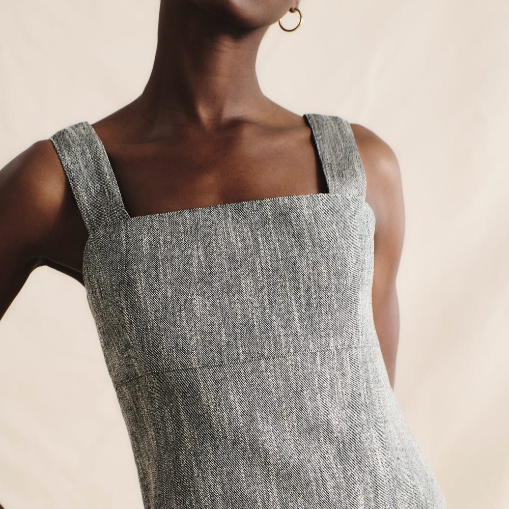 front image of a woman wearing the jennifer dress in black/ivory