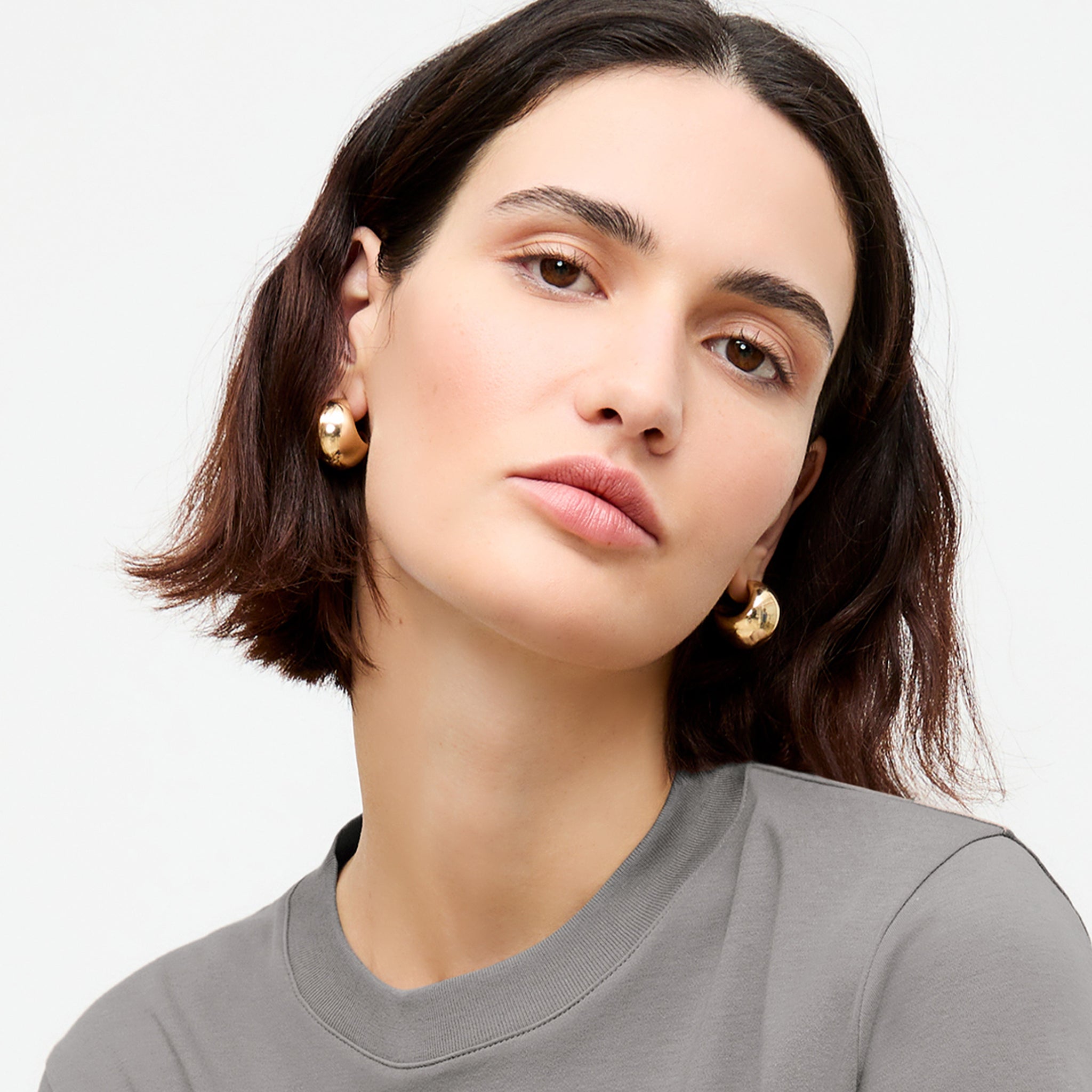 image of a woman wearing the karis earring in gold