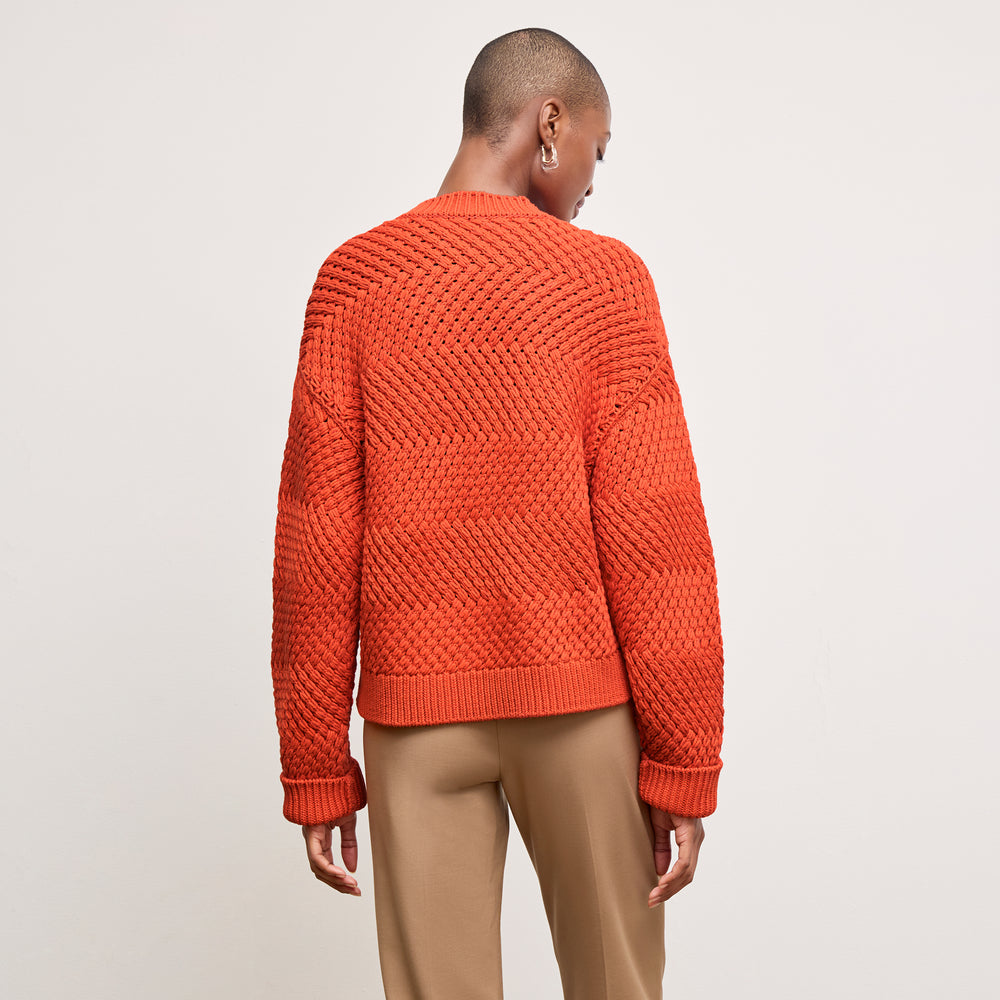 back image of a woman wearing the kiki sweater in valencia