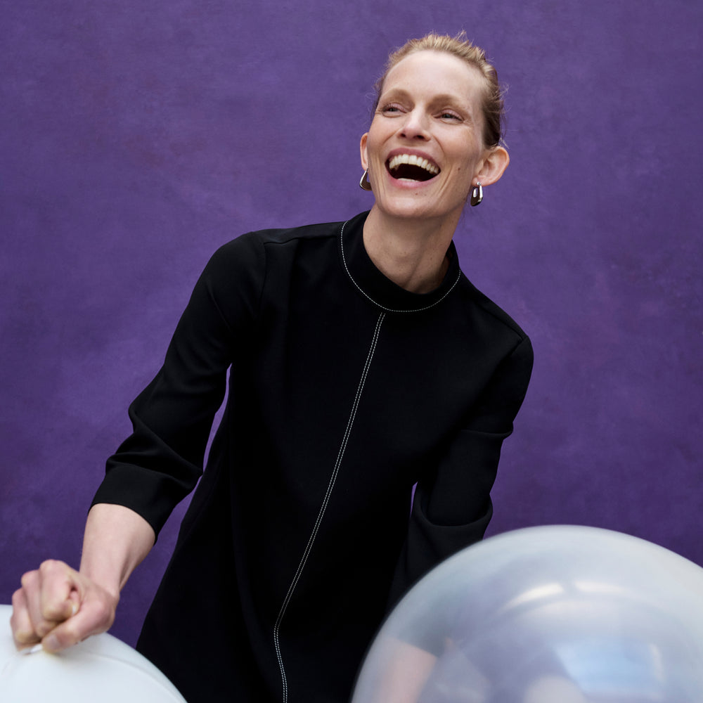 image of a woman wearing the kinsley dress in black