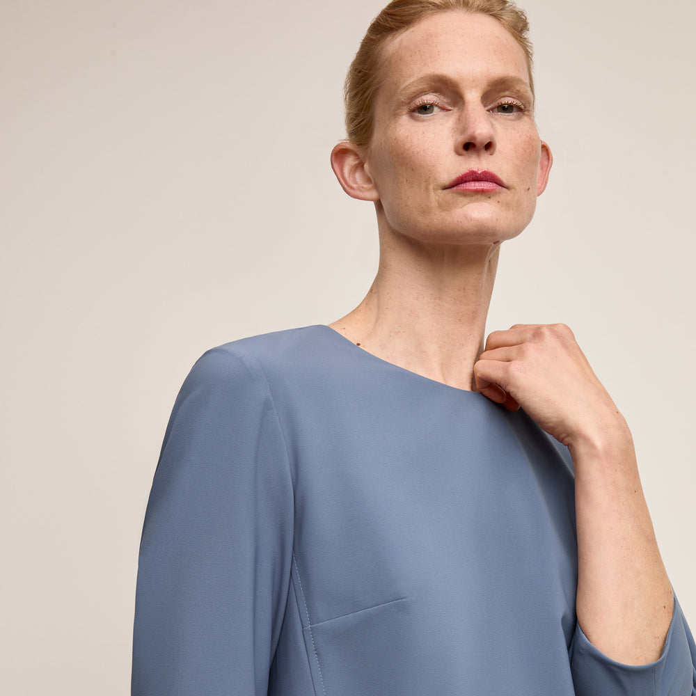 Front image of a woman wearing Lancia Dress Origamitech Dusty Blue