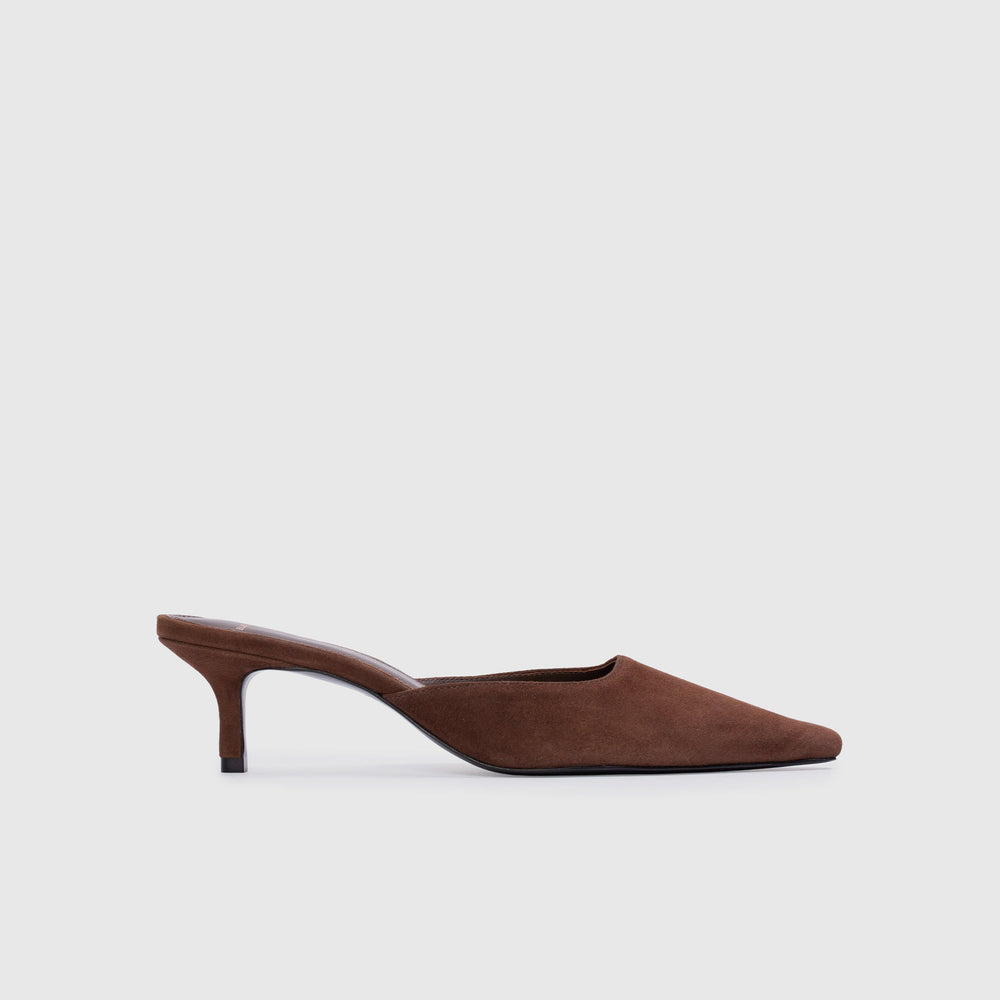 Brown suede high-heeled shoe on a light gray background
