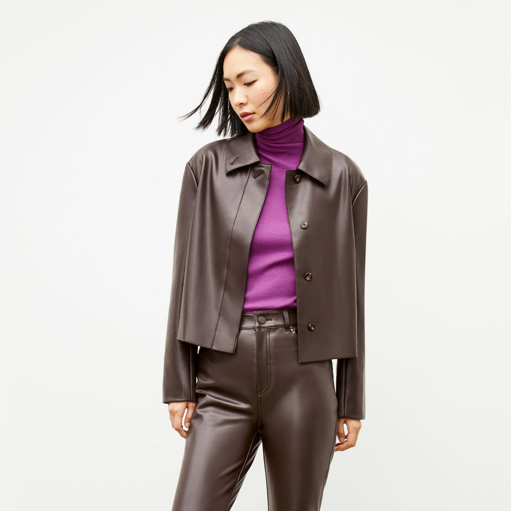Front image of a woman wearing the nicky jacket in brown