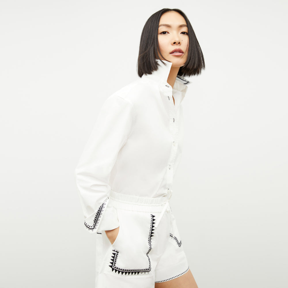 front image of a woman wearing the adina short in white