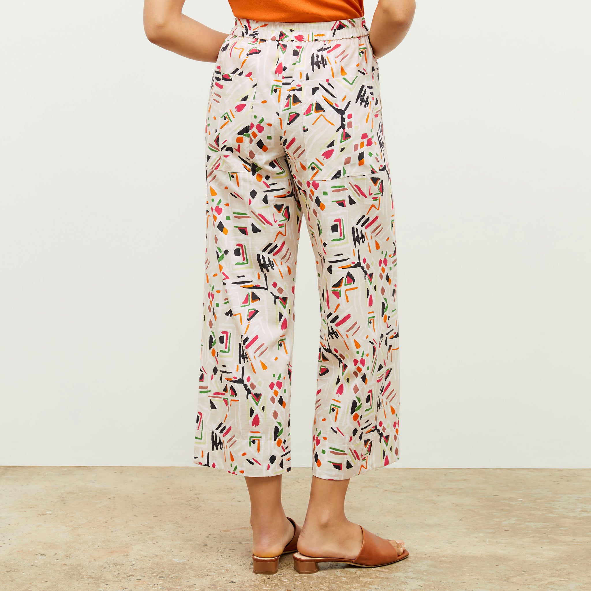 back image of a woman wearing the madelyn pant in rhythm print 
