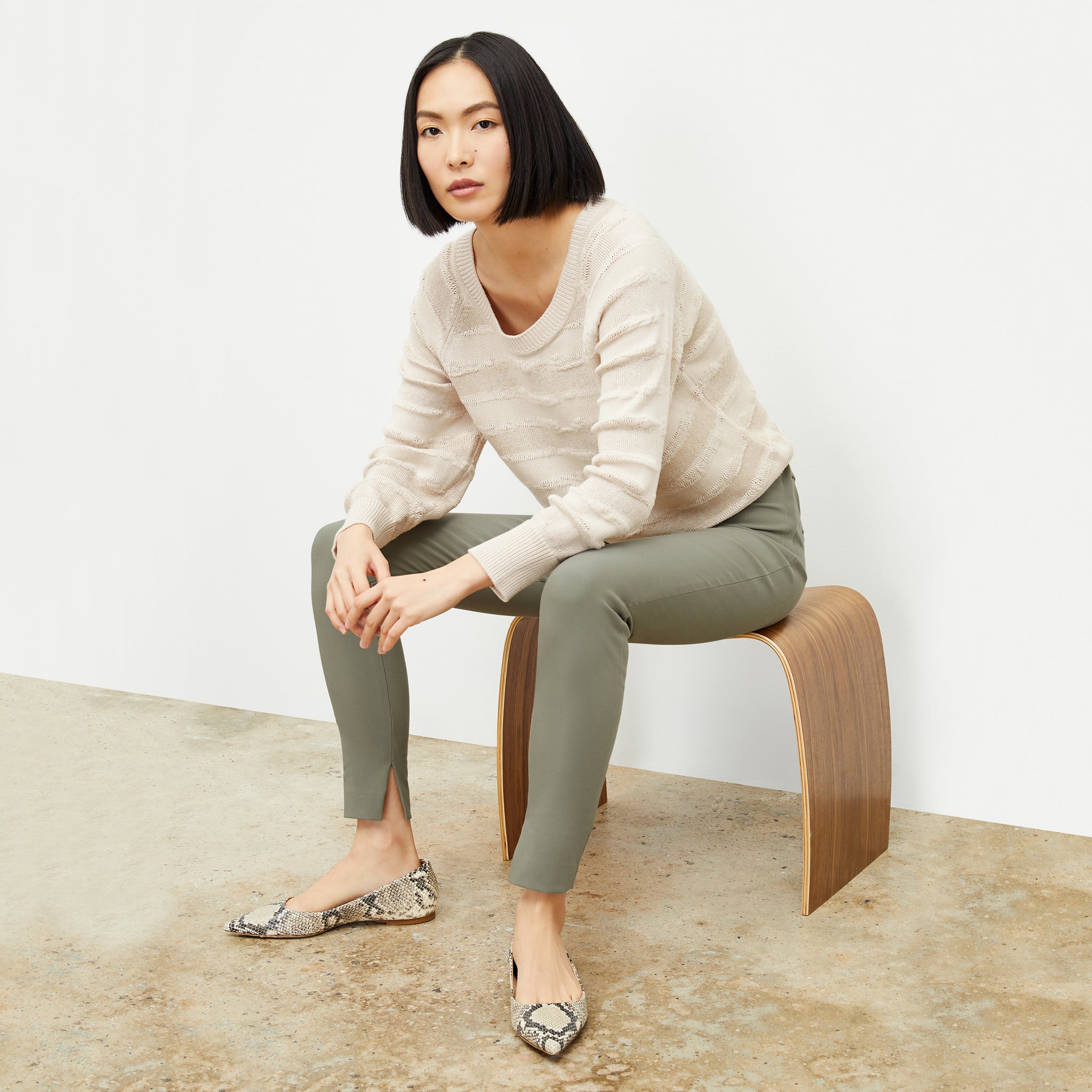 Front image of a woman wearing the skinny foster in thyme