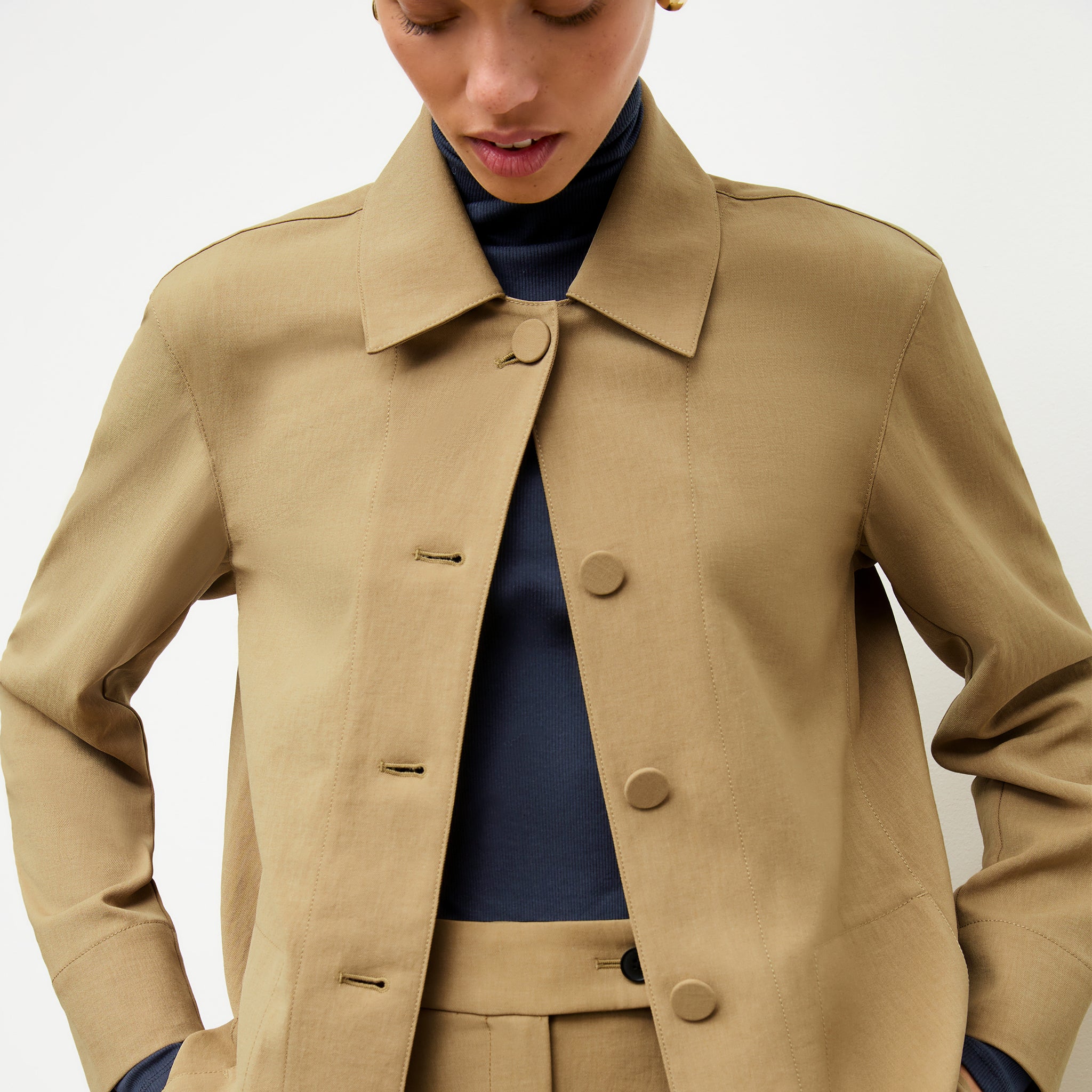 front image of a woman wearing the avelyn jacket in macaroon