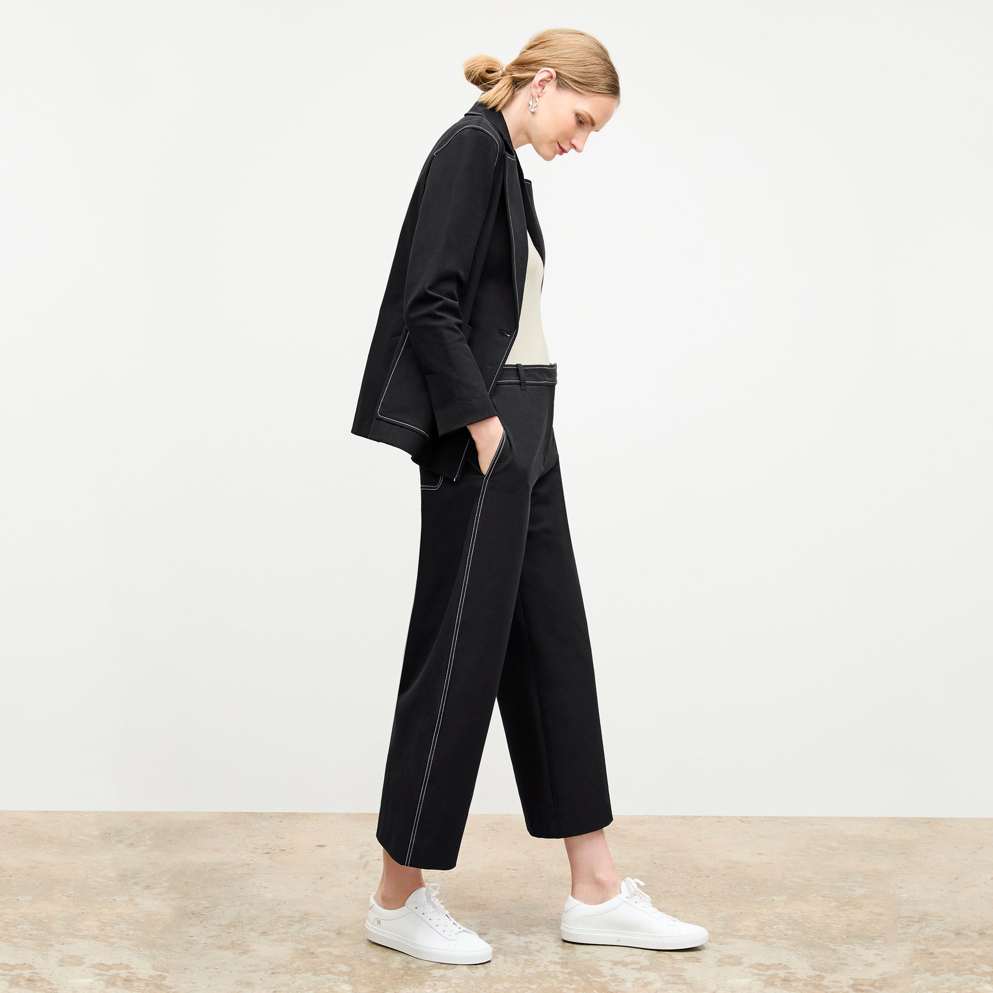 side image of a woman wearing the abby pant in black