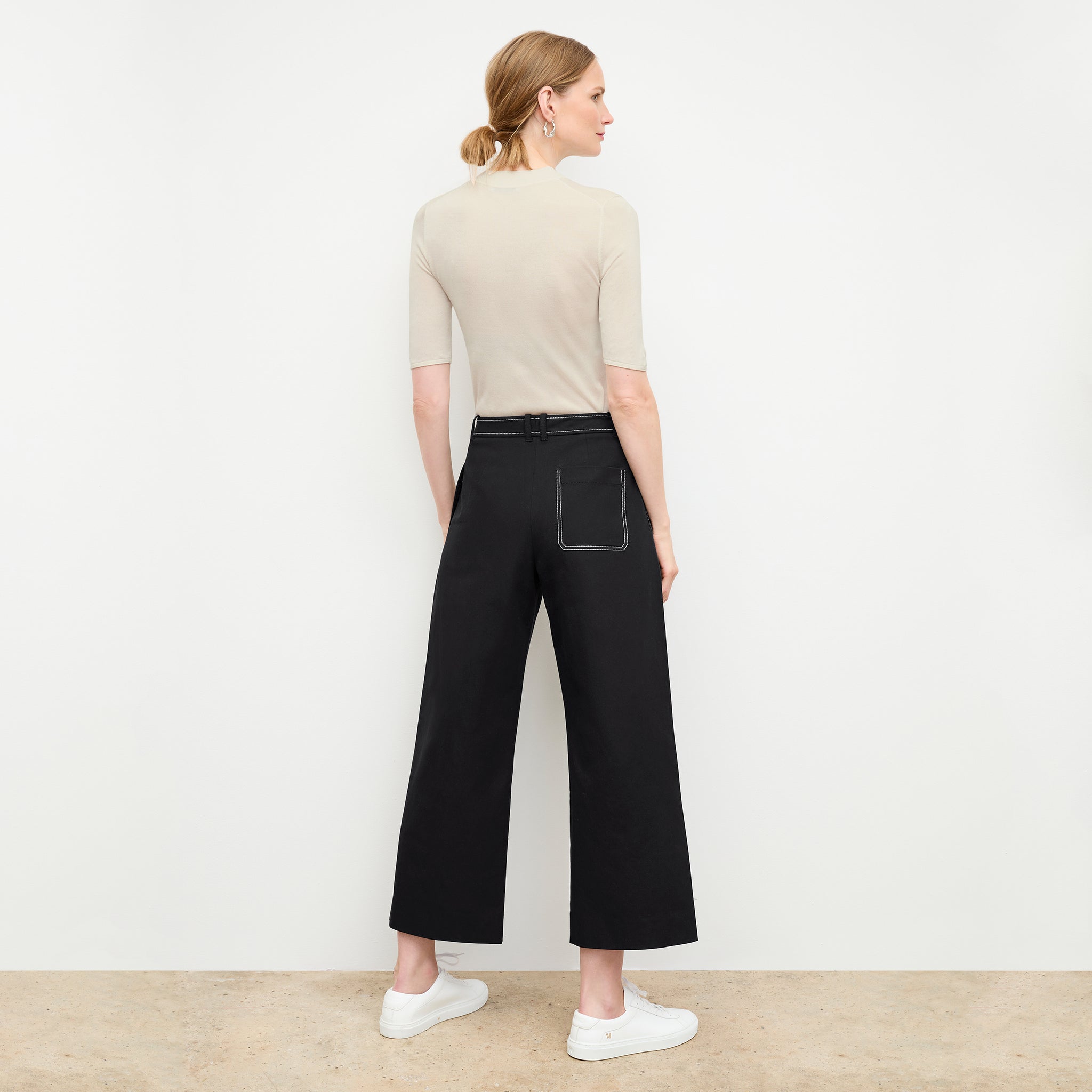 back image of a woman wearing the abby pant in black