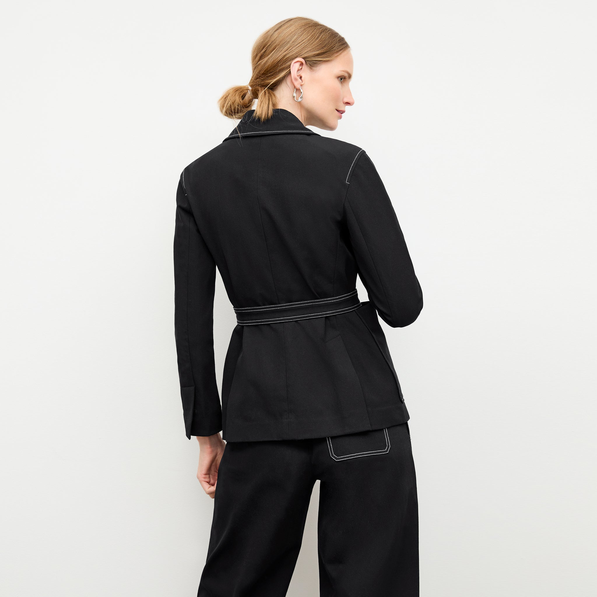 back image of a woman wearing the grenville jacket in black 