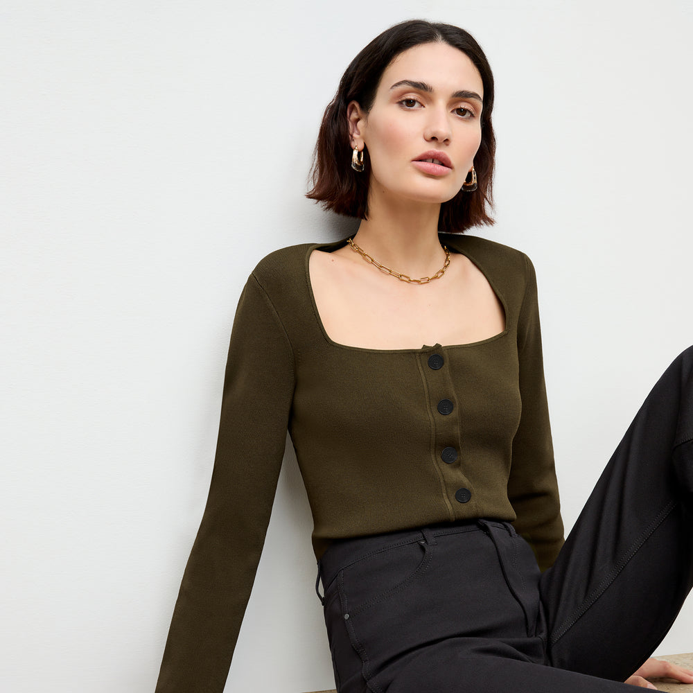 front image of a woman wearing the jin jardigan in dark elm
