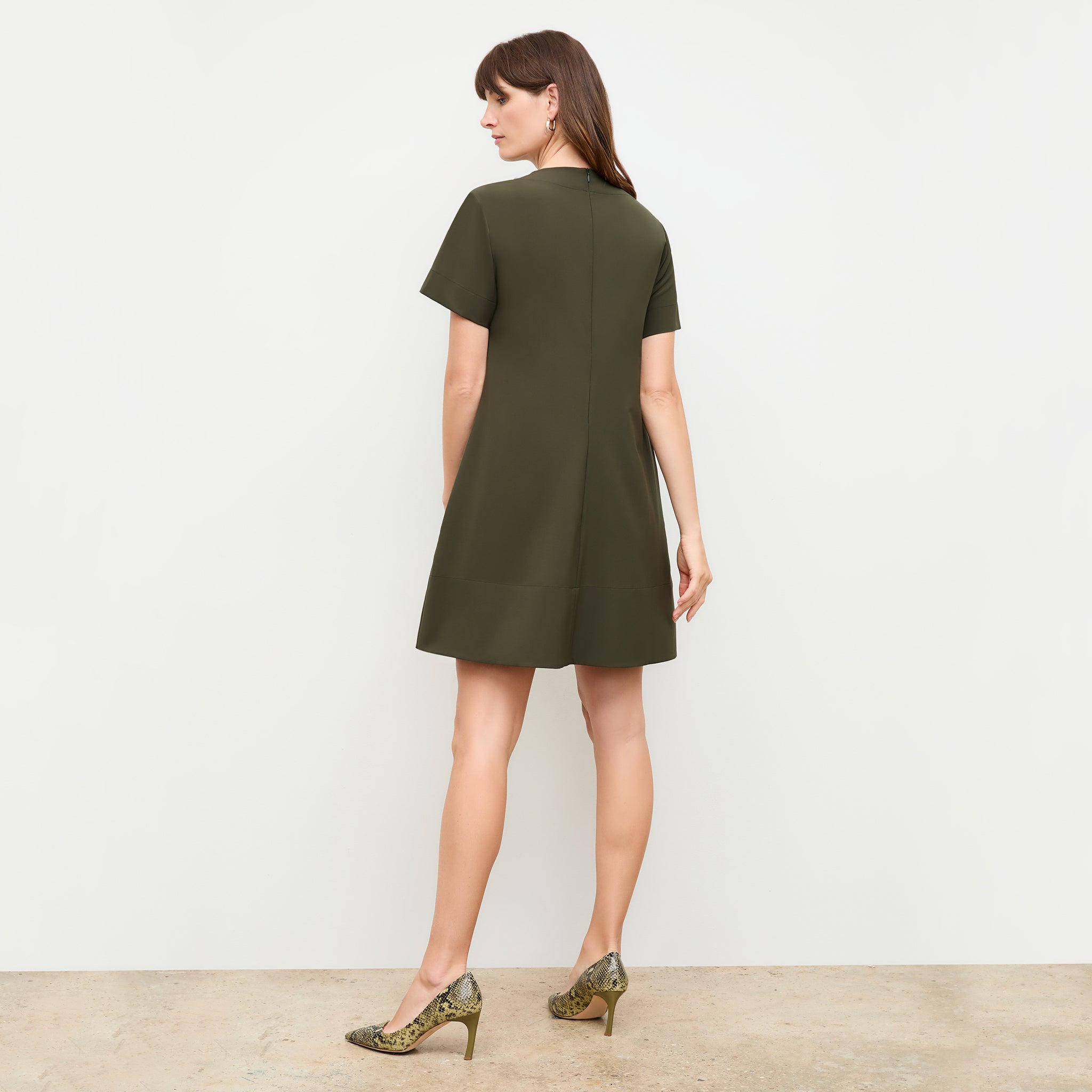 back image of a woman wearing the Corrie Dress in Olive