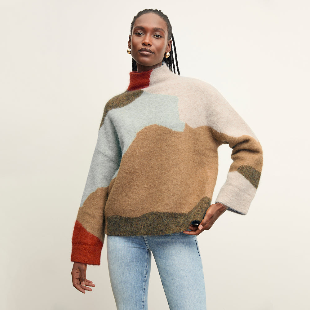 front image of a woman wearing the rajni sweater in multi
