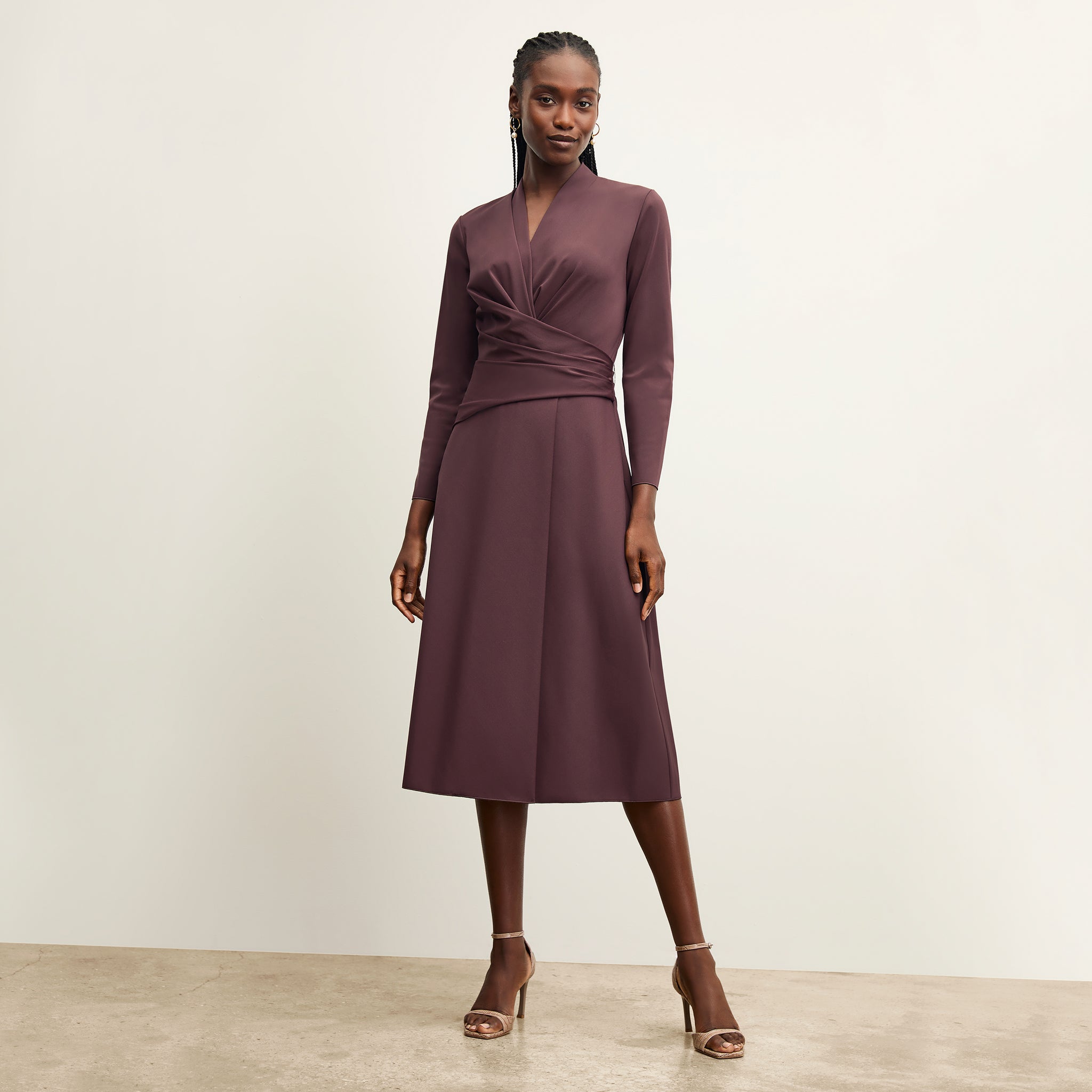 front image of a woman wearing the carly dress in grape 