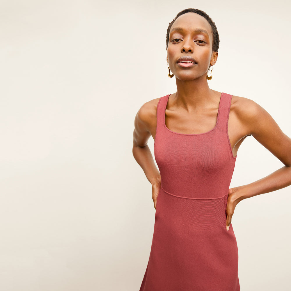 front image of a woman wearing the lottie dress in carnation