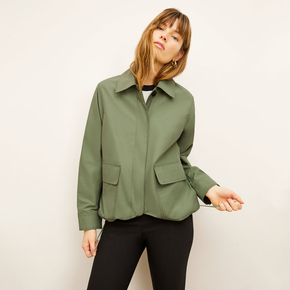 Front image of a woman wearing the Ness Jacket