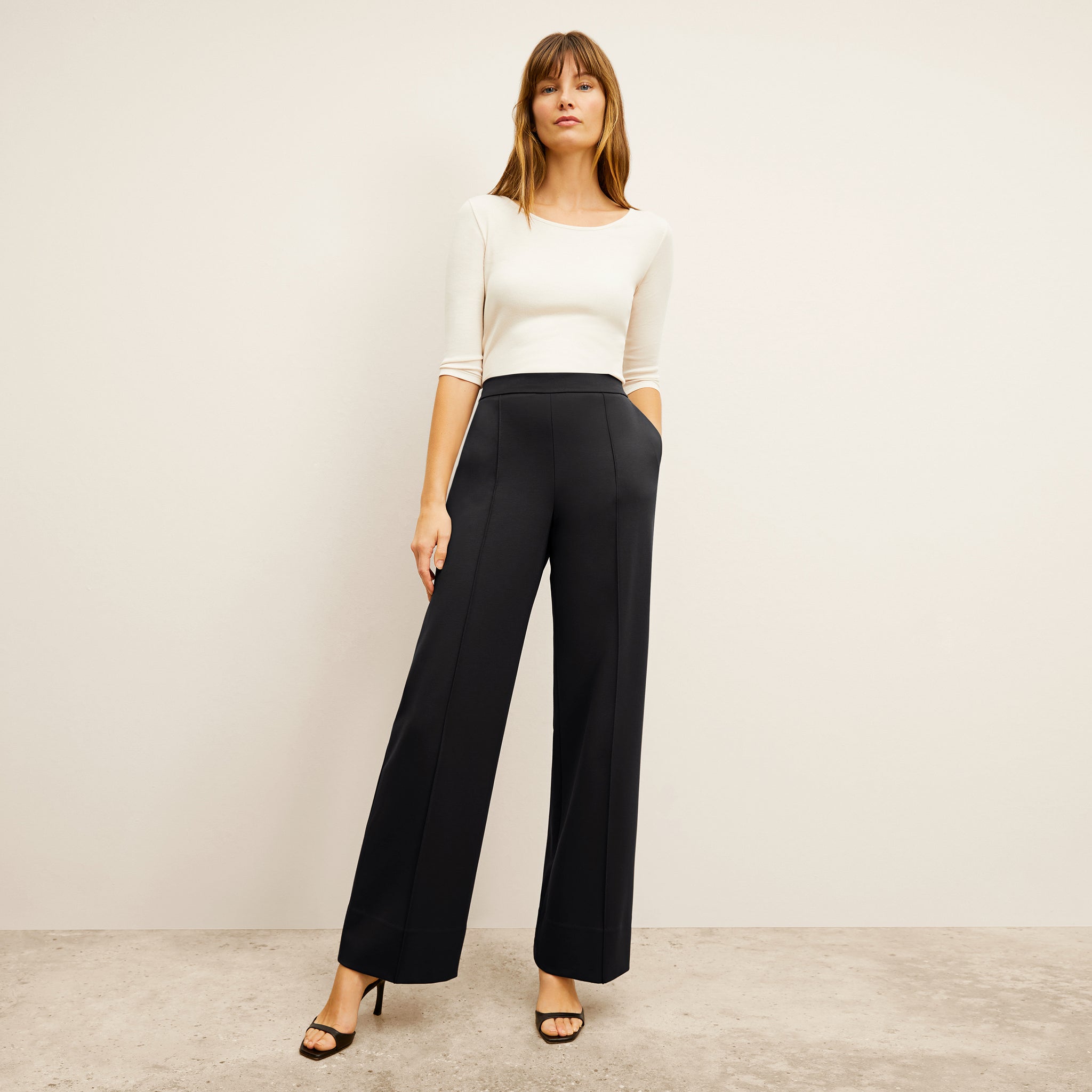 front image of a woman wearing the jordan trouser in black 