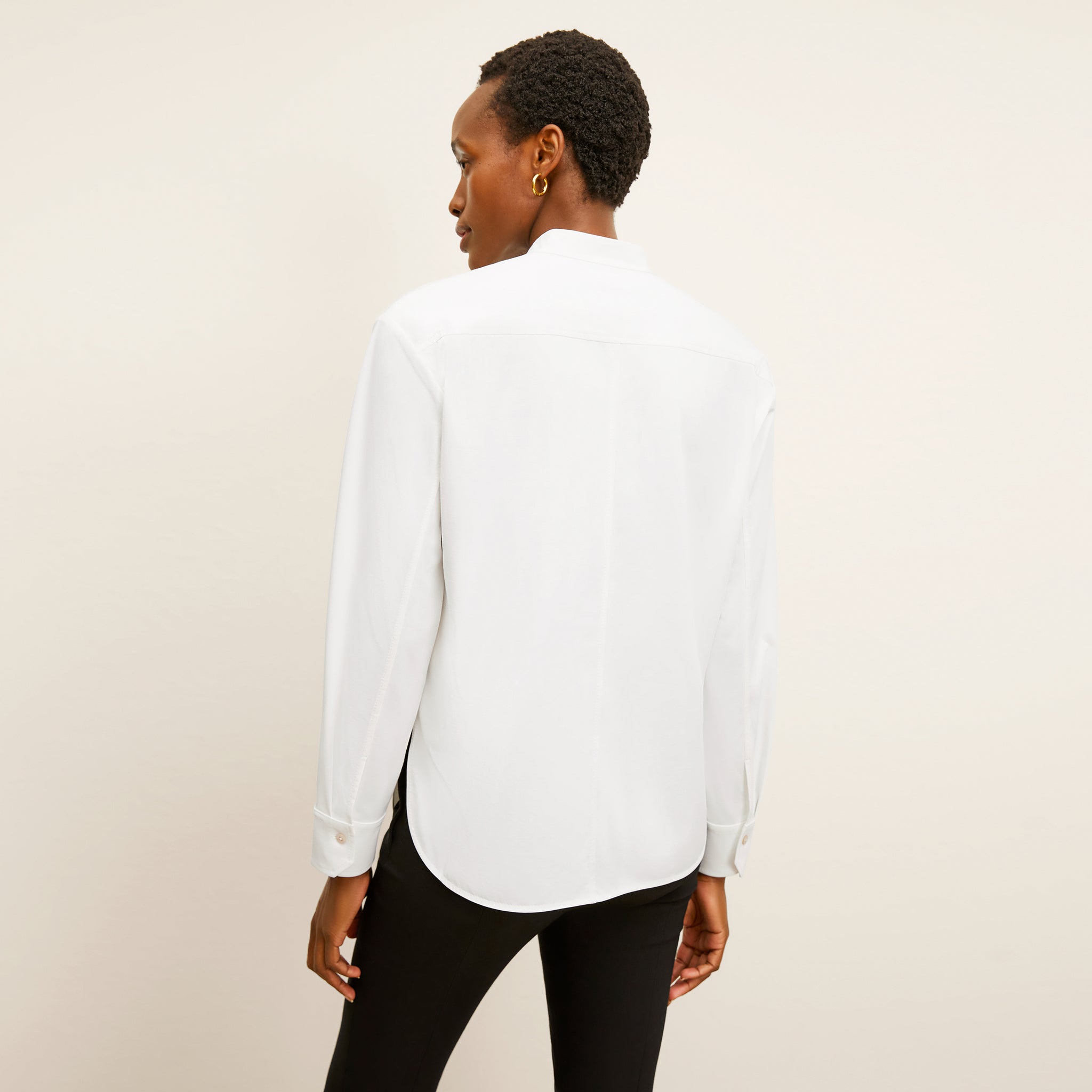 back image of a woman wearing the tonya top in white