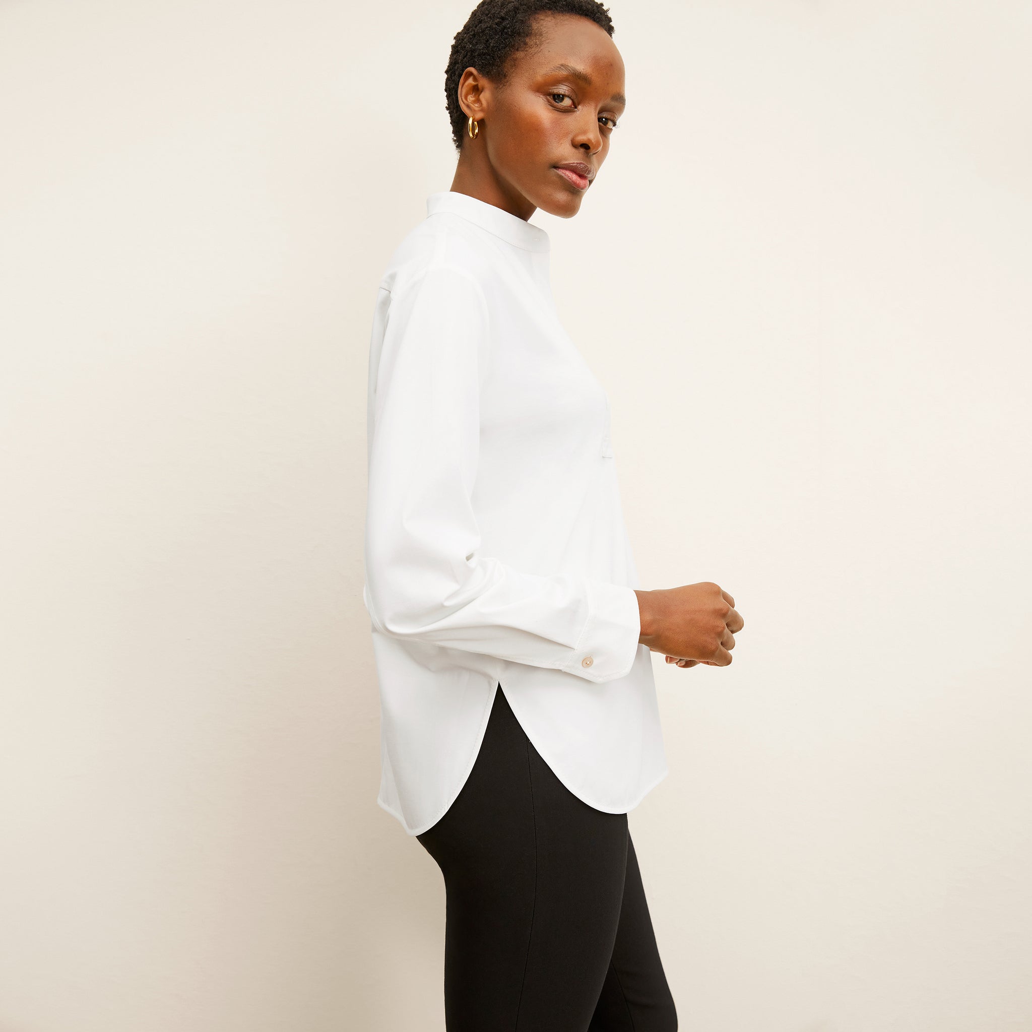 side image of a woman wearing the tonya top in white